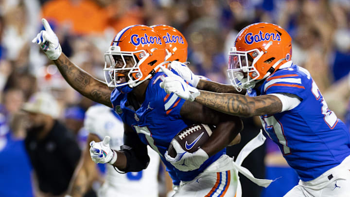 Oct 19, 2024; Gainesville, Florida, USA; Florida Gators defensive back Trikweze Bridges (7) runs with Florida Gators defensive back Dijon Johnson (27) after an interception against the Kentucky Wildcats during the first half at Ben Hill Griffin Stadium. Mandatory Credit: Matt Pendleton-Imagn Images