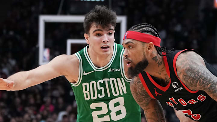 Toronto Raptors forward Brandon Ingram controls the ball as Boston Celtics guard Hugo Gonzalez tries to defend