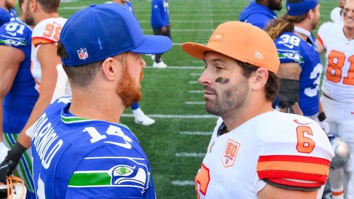 Oct 5, 2025; Seattle, Washington, USA; Seattle Seahawks quarterback Sam Darnold (14) and Tampa Bay Buccaneers quarterback Baker Mayfield (6) Mandatory Credit: Steven Bisig-Imagn Images