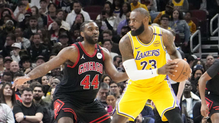 Mar 27, 2025; Chicago, Illinois, USA; Chicago Bulls forward Patrick Williams (44) defends Los Angeles Lakers forward LeBron James (23) during the first quarter at United Center. Mandatory Credit: David Banks-Imagn Images