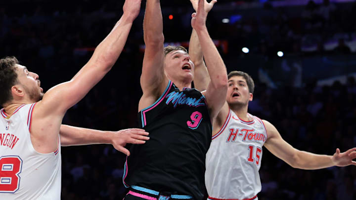 Feb 28, 2026; Miami, Florida, USA; Miami Heat guard Pelle Larsson (9) drives to the basket against Houston Rockets center Alperen Sengun (28) and guard Reed Sheppard (15) during the fourth quarter at Kaseya Center. Mandatory Credit: Sam Navarro-Imagn Images Feb 28, 2026; Miami, Florida, USA; Miami Heat guard Pelle Larsson (9) drives to the basket against Houston Rockets center Alperen Sengun (28) and guard Reed Sheppard (15) during the fourth quarter at Kaseya Center. Mandatory Credit: Sam Navarro-Imagn Images