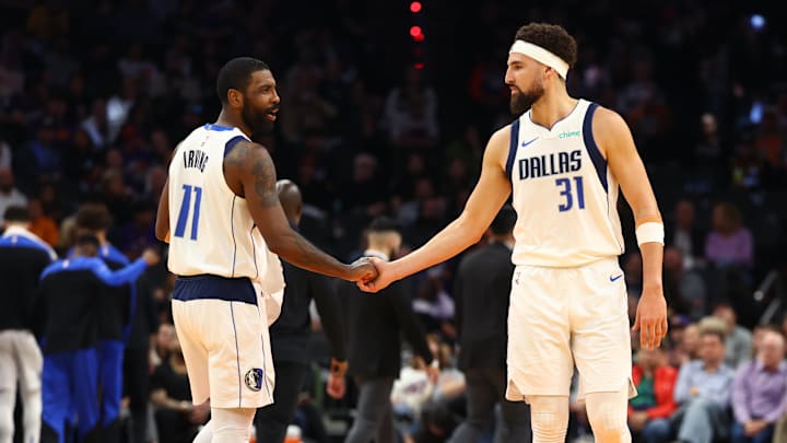 Dec 27, 2024; Phoenix, Arizona, USA; Dallas Mavericks guard Kyrie Irving (11) and Klay Thompson (31) against the Phoenix Suns at Footprint Center. Mandatory Credit: Mark J. Rebilas-Imagn Images