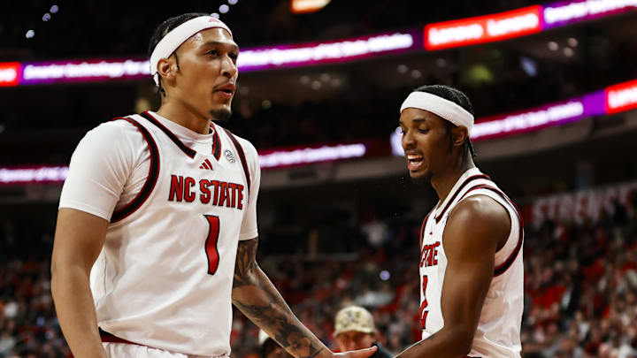 Jan 27, 2026; Raleigh, North Carolina, USA; NC State Wolfpack guard Jr. Paul McNeil (2) celebrates a 3-pointer with forward Darrion Williams (1) during the first half of the game against the Syracuse Orange at Lenovo Center. Mandatory Credit: Jaylynn Nash-Imagn Images