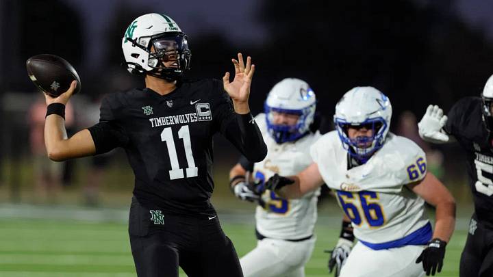 Norman North quarterback Nash Henry (11) drop back to pass. Norman North quarterback Nash Henry (11) drop back to pass.