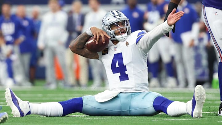 Dallas Cowboys quarterback Dak Prescott (4) reacts after a play against the New York Giants during overtime at AT&T Stadium.