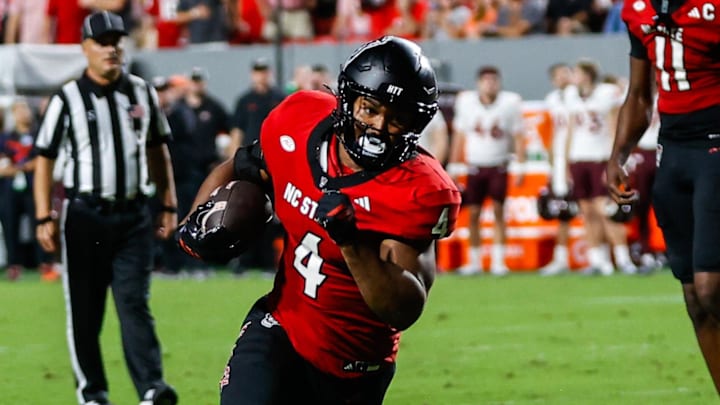 Sep 27, 2025; Raleigh, North Carolina, USA; North Carolina State Wolfpack running back Jayden Scott (4) runs towards the end zone  during the first half of the game against Virginia Tech Hokies at Carter-Finley Stadium. Mandatory Credit: Jaylynn Nash-Imagn Images
