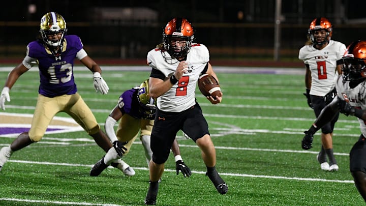 Lely's quarterback Carter Quinn (#8) on a keeper. The Booker Tornadoes hosted the Lely Trojans (Naples, FL) Friday night, Aug. 23, 2024, who lost to Booker 46-0 during the first regular non-conference season game of the year.