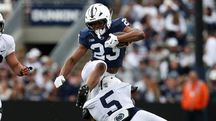 Tikey Hayes hurdles a defender during Penn State's 2025 spring game. Tikey Hayes hurdles a defender during Penn State's 2025 spring game.