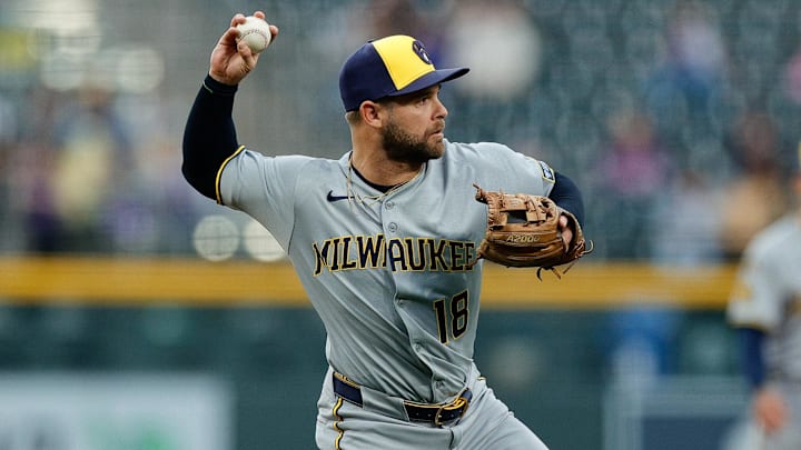 Milwaukee Brewers third baseman Vinny Capra (18) throws to first against the Colorado Rockies at Coors Field. Milwaukee Brewers third baseman Vinny Capra (18) throws to first against the Colorado Rockies at Coors Field.