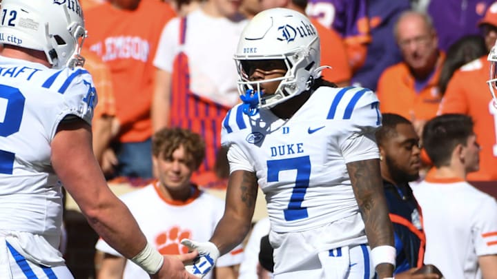 Duke Blue Devils wide receiver Que'Sean Brown (7) celebrates with Duke Blue Devils offensive lineman Matt Craycraft (72) and Duke Blue Devils safety Terry Moore (1) after scoring a touchdown Saturday, Nov. 1, 2025, during the NCAA football game at Memorial Stadium in Clemson, South Carolina.