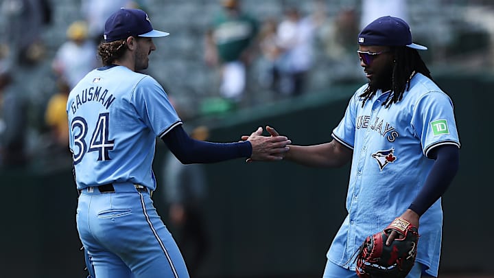 Toronto Blue Jays starting pitcher Kevin Gausman and first baseman Vladimir Guerrero Jr.