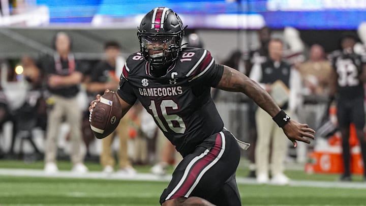 Aug 31, 2025; Atlanta, Georgia, USA; South Carolina Gamecocks quarterback LaNorris Sellers (16) rolls out of the pocket against the Virginia Tech Hokies during the first half at Mercedes-Benz Stadium. Mandatory Credit: Dale Zanine-Imagn Images