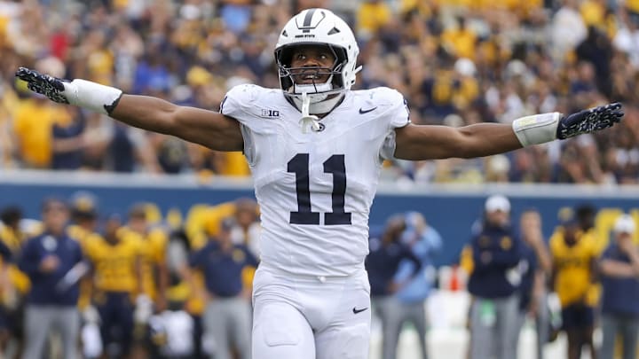 Aug 31, 2024; Morgantown, West Virginia, USA; Penn State Nittany Lions defensive end Abdul Carter (11) celebrates after a defensive stop during the fourth quarter against the West Virginia Mountaineers at Mountaineer Field at Milan Puskar Stadium. Mandatory Credit: Ben Queen-Imagn Images