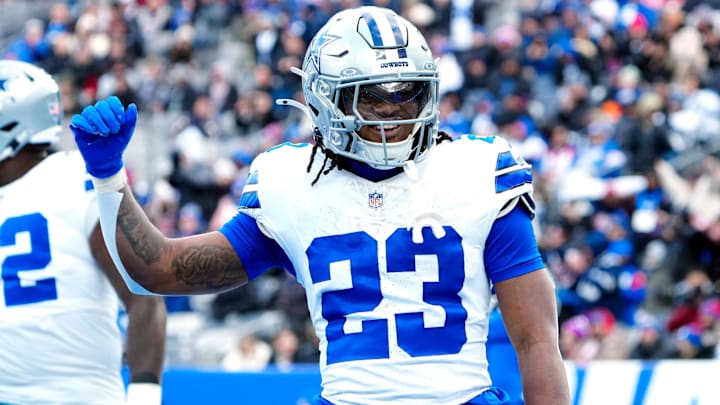 Dallas Cowboys running back Jaydon Blue celebrates after scoring the first touchdown of the game.