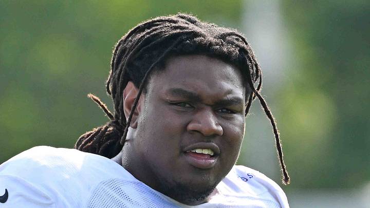Indianapolis Colts guard Jalen Farmer looks on during training camp