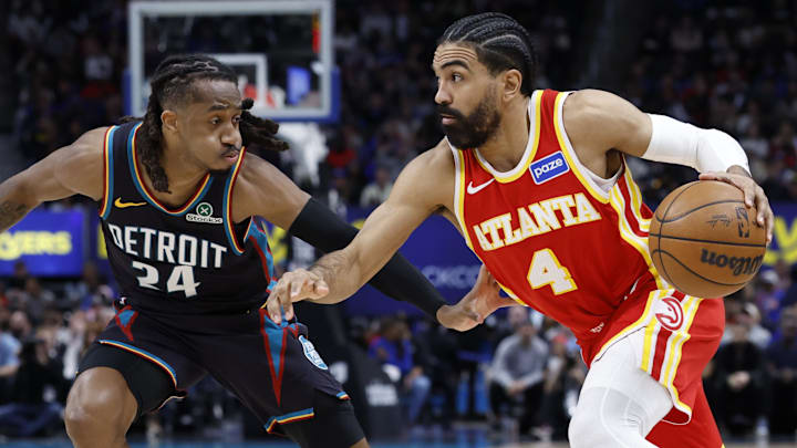 Mar 25, 2026; Detroit, Michigan, USA;  Atlanta Hawks guard Gabe Vincent (4) dribbles defended by Detroit Pistons guard Daniss Jenkins (24) in the second half at Little Caesars Arena. Mandatory Credit: Rick Osentoski-Imagn Images