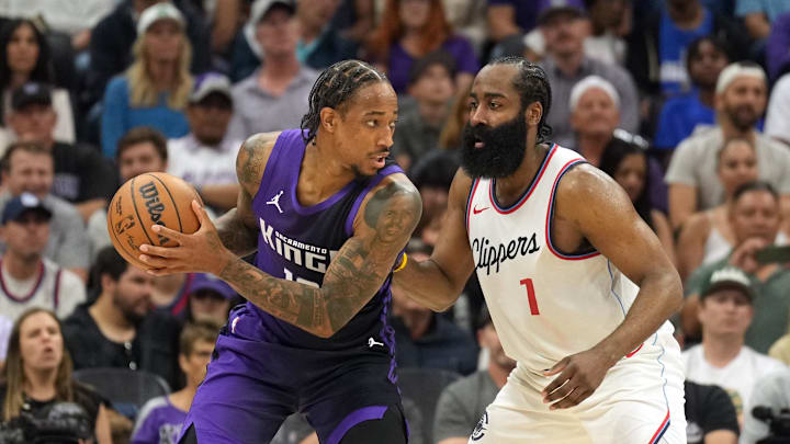 Apr 11, 2025; Sacramento, California, USA; Sacramento Kings forward DeMar DeRozan (center left) handles the ball against Los Angeles Clippers guard James Harden (1) during the fourth quarter at Golden 1 Center. Mandatory Credit: Darren Yamashita-Imagn Images Apr 11, 2025; Sacramento, California, USA; Sacramento Kings forward DeMar DeRozan (center left) handles the ball against Los Angeles Clippers guard James Harden (1) during the fourth quarter at Golden 1 Center. Mandatory Credit: Darren Yamashita-Imagn Images