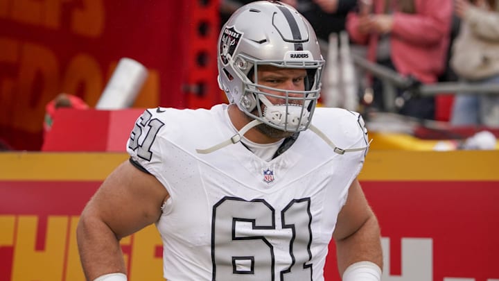 Dec 25, 2023; Kansas City, Missouri, USA; Las Vegas Raiders guard Jordan Meredith (61) runs onto the field against the Kansas City Chiefs prior to a game at GEHA Field at Arrowhead Stadium. Mandatory Credit: Denny Medley-Imagn Images