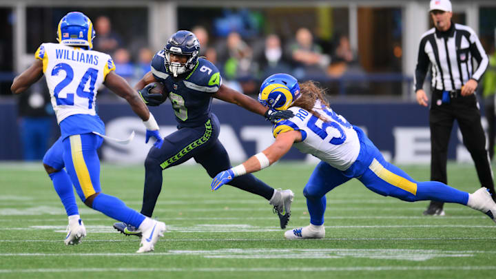 Nov 3, 2024; Seattle, Washington, USA; Seattle Seahawks running back Kenneth Walker III (9) stiff arms Los Angeles Rams linebacker Christian Rozeboom (56) during a run play in the second half at Lumen Field. Mandatory Credit: Steven Bisig-Imagn Images Nov 3, 2024; Seattle, Washington, USA; Seattle Seahawks running back Kenneth Walker III (9) stiff arms Los Angeles Rams linebacker Christian Rozeboom (56) during a run play in the second half at Lumen Field. Mandatory Credit: Steven Bisig-Imagn Images