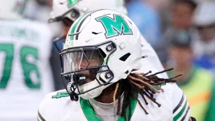 Marshall wide receiver Demarcus Lacey (4) carries the ball during MTSU's Homecoming football game 