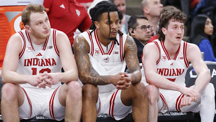 Mar 11, 2026; Chicago, IL, USA; Indiana Hoosiers forward Tucker DeVries (12), guard Lamar Wilkerson (3) and guard Conor Enright (5) sit on the bench during the second half at United Center.