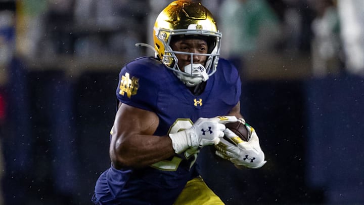 Notre Dame Fighting Irish running back Jadarian Price runs the ball against the Southern California Trojans.