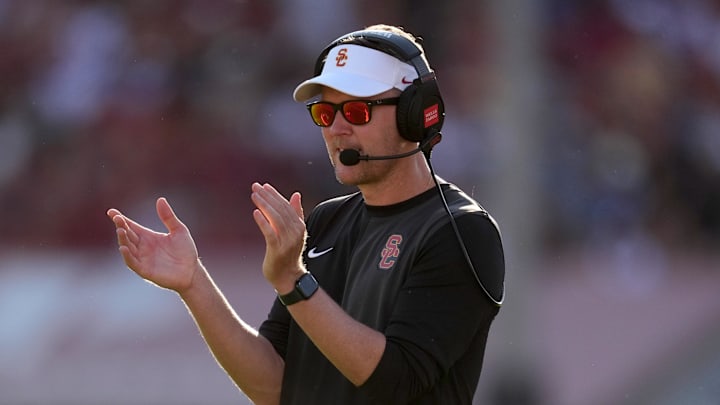 Aug 30, 2025; Los Angeles, California, USA; Southern California Trojans head coach Lincoln Riley watches from the sidelines against the Missouri State Bears in the first half at United Airlines Field at Los Angeles Memorial Coliseum. Mandatory Credit: Kirby Lee-Imagn Images