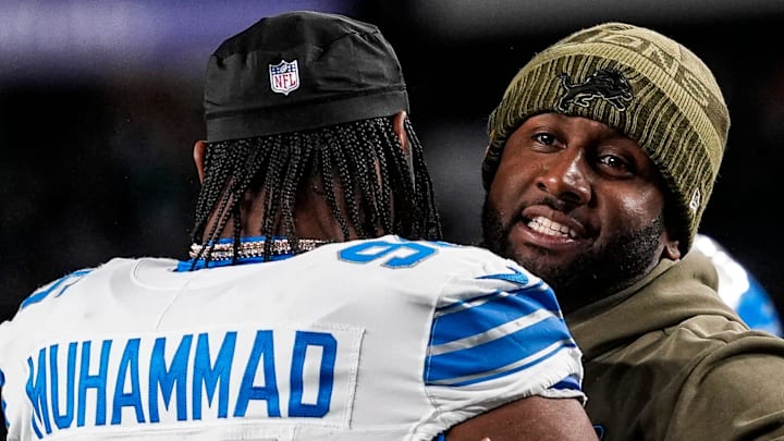 Detroit Lions defensive coordinator Kelvin Sheppard hugs linebacker Al-Quadin Muhammad (96) Detroit Lions defensive coordinator Kelvin Sheppard hugs linebacker Al-Quadin Muhammad (96)