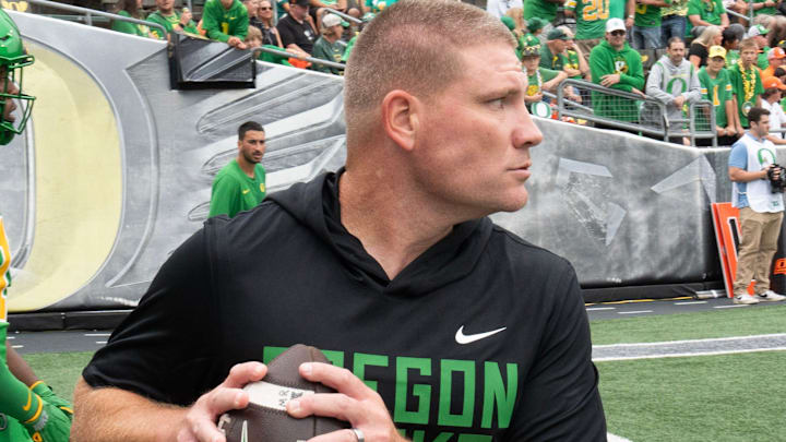 Oregon Defensive Coordinator Tosh Lupoi runs a warmup drill with his team before the game against Oklahoma State at Autzen. Oregon Defensive Coordinator Tosh Lupoi runs a warmup drill with his team before the game against Oklahoma State at Autzen.