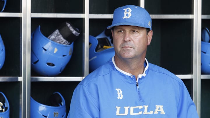 Jun 24, 2013; Omaha, NE, USA; UCLA Bruins head coach John Savage (22) looks on in the dugout before game 1 of the College World Series finals against the Mississippi State Bulldogs at TD Ameritrade Park. Mandatory Credit: Bruce Thorson-Imagn Images