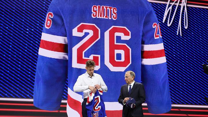 Jun 26, 2026; Buffalo, New York, USA; Alberts Smits reacts beside NHL commissioner Gary Bettman after being selected with the fifth pick in the first round of the 2026 NHL Draft by the New York Rangers at KeyBank Center. Jun 26, 2026; Buffalo, New York, USA; Alberts Smits reacts beside NHL commissioner Gary Bettman after being selected with the fifth pick in the first round of the 2026 NHL Draft by the New York Rangers at KeyBank Center.
