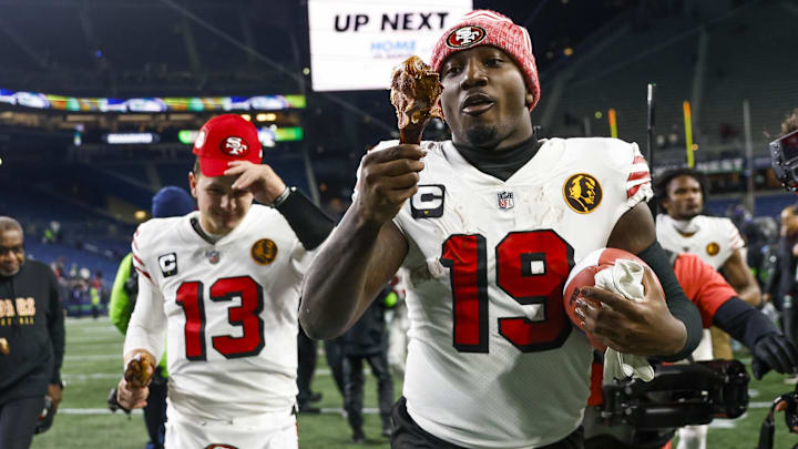 Nov 23, 2023; Seattle, Washington, USA; San Francisco 49ers wide receiver Deebo Samuel (19) eats a turkey leg as he and quarterback Brock Purdy (13) jog to the locker room following a 31-13 victory against the Seattle Seahawks at Lumen Field. Mandatory Credit: Joe Nicholson-Imagn Images Nov 23, 2023; Seattle, Washington, USA; San Francisco 49ers wide receiver Deebo Samuel (19) eats a turkey leg as he and quarterback Brock Purdy (13) jog to the locker room following a 31-13 victory against the Seattle Seahawks at Lumen Field. Mandatory Credit: Joe Nicholson-Imagn Images