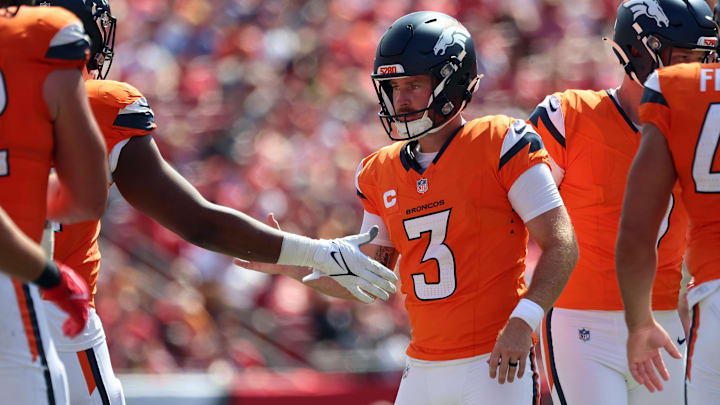 Sep 22, 2024; Tampa, Florida, USA; Denver Broncos place kicker Wil Lutz (3) is congratulated after he made a field goal against the Tampa Bay Buccaneers during the second half at Raymond James Stadium. 
