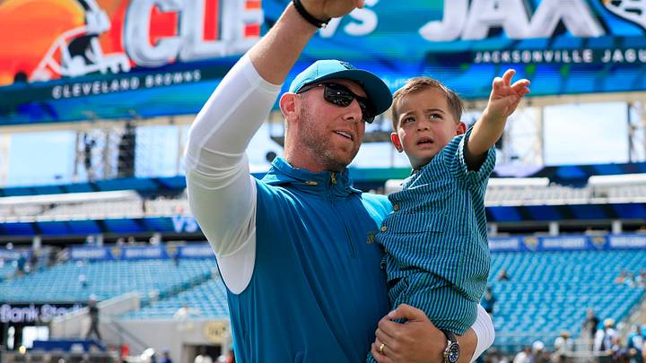 Jacksonville Jaguars head coach Liam Coen points out with his son Callahan, 2, as Jackson, 5, looks on before an NFL football matchup at EverBank Stadium on Sunday, Sept. 13, 2026, in Jacksonville, Fla. The Jaguars defeated the Browns 34-10.