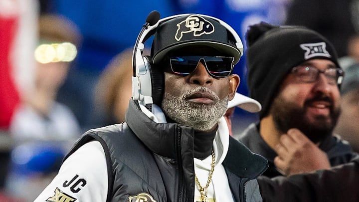 Nov 23, 2024; Kansas City, Missouri, USA;  Colorado head coach Deion Sanders watches the run of play during the 3rd quarter between the Kansas Jayhawks and the Colorado Buffaloes at GEHA Field at Arrowhead Stadium. Mandatory Credit: Nick Tre. Smith-Imagn Images