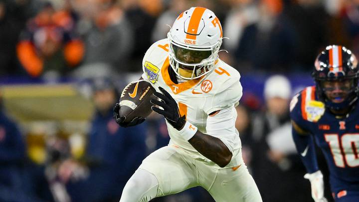 Dec 30, 2025; Nashville, TN, USA; Tennessee Volunteers wide receiver Mike Matthews (4) runs with the ball after a made catch against the Illinois Fighting Illini during the first half at Nissan Stadium. Mandatory Credit: Steve Roberts-Imagn Images
