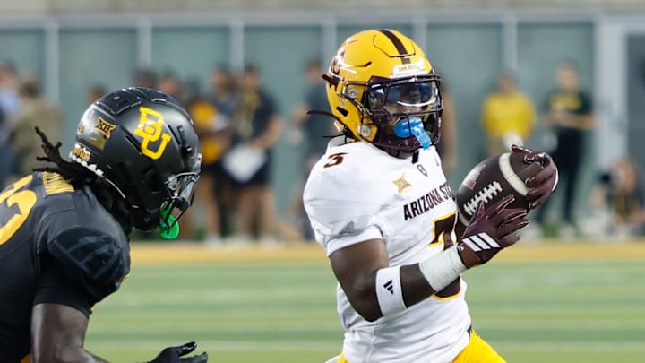 Sep 20, 2025; Waco, Texas, USA; Arizona State Sun Devils running back Raleek Brown (3) carries the ball as Baylor Bears safety DJ Coleman (33) gives chase during the first half at McLane Stadium. Mandatory Credit: Chris Jones-Imagn Images