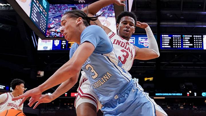 Oct 18, 2026; Indianapolis, IN, USA; North Carolina Tar Heels guard Matt Able (3) dribbles out of bounds against Indiana Hoosiers guard Jaeden Mustaf (3) during the first half at Gainbridge Fieldhouse. Mandatory Credit: Robert Goddin-Imagn Images
