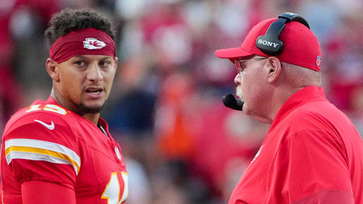 Aug 22, 2025; Kansas City, Missouri, USA; Kansas City Chiefs quarterback Patrick Mahomes (15) talks with head coach Andy Reid after a play against the Chicago Bears during the first half of the game at GEHA Field at Arrowhead Stadium. Mandatory Credit: Denny Medley-Imagn Images