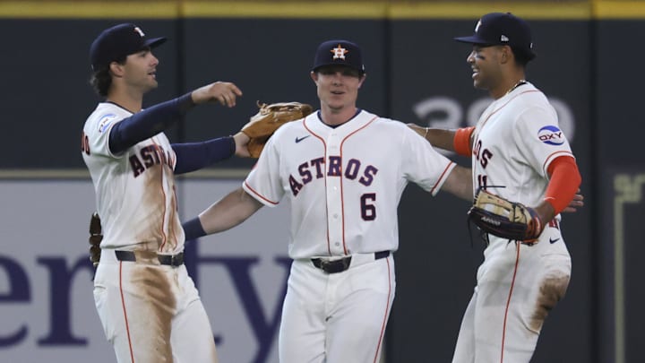 Houston Astros left fielder Shay Whitcomb (10) and center fielder Jake Meyers (6) and right fielder Cam Smith (11) celebrate after the game. 