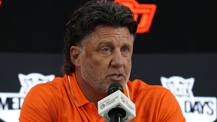 Jul 9, 2025; Frisco, TX, USA; Oklahoma State head coach Mike Gundy speaks with the media during 2025 Big 12 Football Media Days at The Star. Mandatory Credit: Raymond Carlin III-Imagn Images Jul 9, 2025; Frisco, TX, USA; Oklahoma State head coach Mike Gundy speaks with the media during 2025 Big 12 Football Media Days at The Star. Mandatory Credit: Raymond Carlin III-Imagn Images
