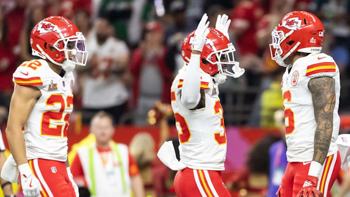 Feb 9, 2025; New Orleans, LA, USA;  Kansas City Chiefs safety Bryan Cook (6) celebrates with teammates Jaylen Watson (35) and Trent McDuffie (22) after an interception against the Philadelphia Eagles in the second quarter in Super Bowl LIX at Ceasars Superdome. Mandatory Credit: Mark J. Rebilas-Imagn Images