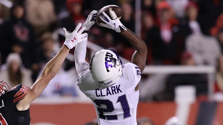 Oct 19, 2024; Salt Lake City, Utah, USA; TCU Horned Frogs safety Bud Clark (21) intercepts a pass intended for Utah Utes wide receiver Luca Caldarella (19) during the fourth quarter at Rice-Eccles Stadium. Mandatory Credit: Rob Gray-Imagn Images