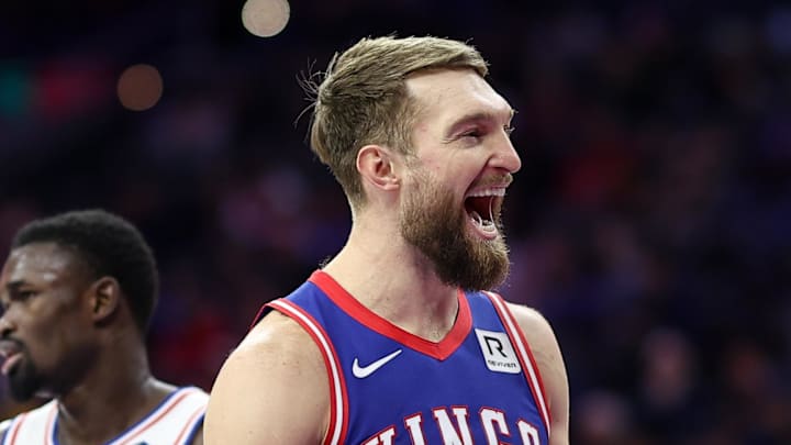 Jan 29, 2025; Philadelphia, Pennsylvania, USA; Sacramento Kings forward Domantas Sabonis (11) reacts to a play in front of Philadelphia 76ers center Adem Bona (30) during the second quarter at Wells Fargo Center.