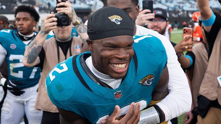 Jacksonville Jaguars wide receiver Travis Hunter (12) and Cleveland Browns quarterback Shedeur Sanders (2) joke around at midfield after an NFL football game at EverBank Stadium, Sunday, September 13, 2026, in Jacksonville, Fla.