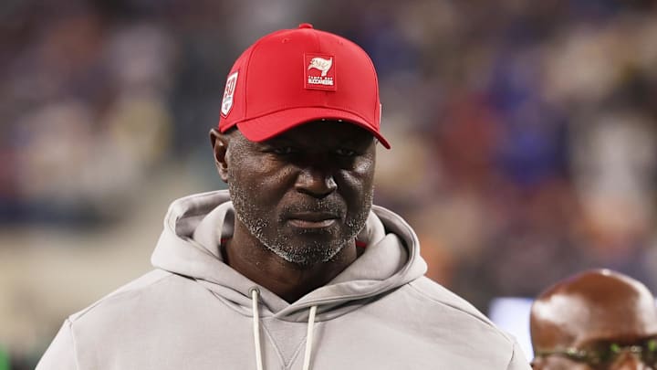 Tampa Bay Buccaneers head coach and defensive coordinator Todd Bowles walks off the field during halftime against the Los Angeles Rams 