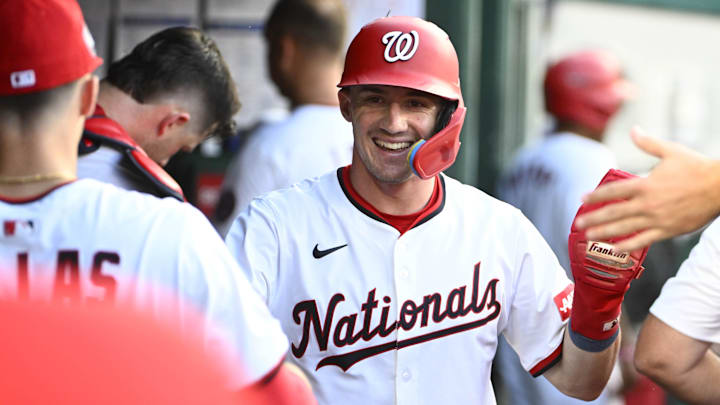Jul 22, 2025; Washington, District of Columbia, USA; Washington Nationals center fielder Jacob Young (30) is congratulated by teammates after scoring a run against the Cincinnati Reds during the fifth inning at Nationals Park. Jul 22, 2025; Washington, District of Columbia, USA; Washington Nationals center fielder Jacob Young (30) is congratulated by teammates after scoring a run against the Cincinnati Reds during the fifth inning at Nationals Park.
