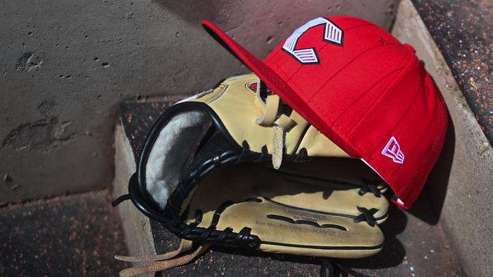Apr 11, 2026; Cincinnati, Ohio, USA; A view of an official Cincinnati Reds hat on the dugout steps during the game against the Los Angeles Angels at Great American Ball Park. Mandatory Credit: Aaron Doster-Imagn Images Apr 11, 2026; Cincinnati, Ohio, USA; A view of an official Cincinnati Reds hat on the dugout steps during the game against the Los Angeles Angels at Great American Ball Park. Mandatory Credit: Aaron Doster-Imagn Images