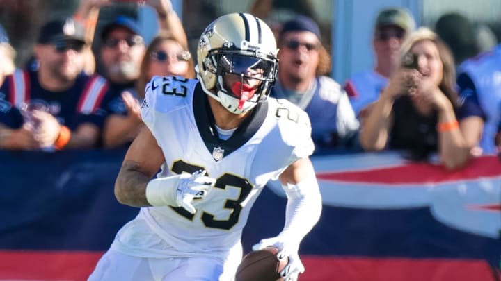 Sep 26, 2021; Foxborough, Massachusetts, USA; New Orleans Saints cornerback Marshon Lattimore (23) intercepts a pass against New England Patriots during the second half at Gillette Stadium. Mandatory Credit: Stephen Lew-Imagn Images