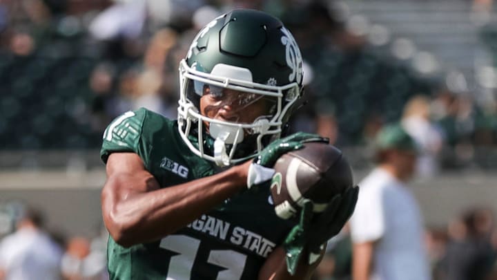 Michigan State wide receiver Aziah Johnson (11) warms up before the Maryland game at Spartan Stadium in East Lansing on Saturday, Sept. 23, 2023.